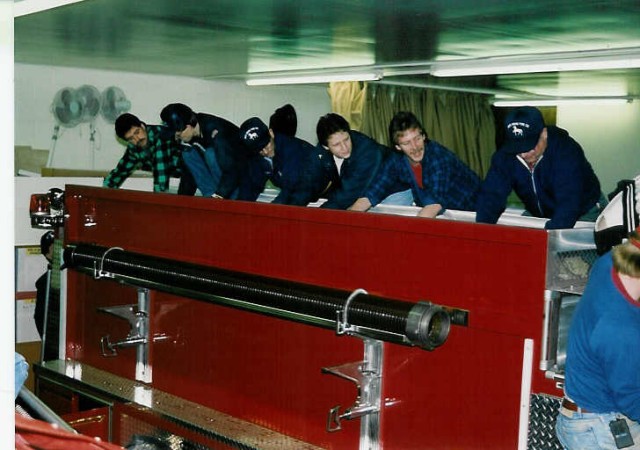 Loading hose unto the  the new Engine 4-9-2. L to R: Dale Martin, Chris Eno, Elvin Martin, Mike Killinger, Larry Kurtz, Mark Beyer, Rodney Gossert... December 1993